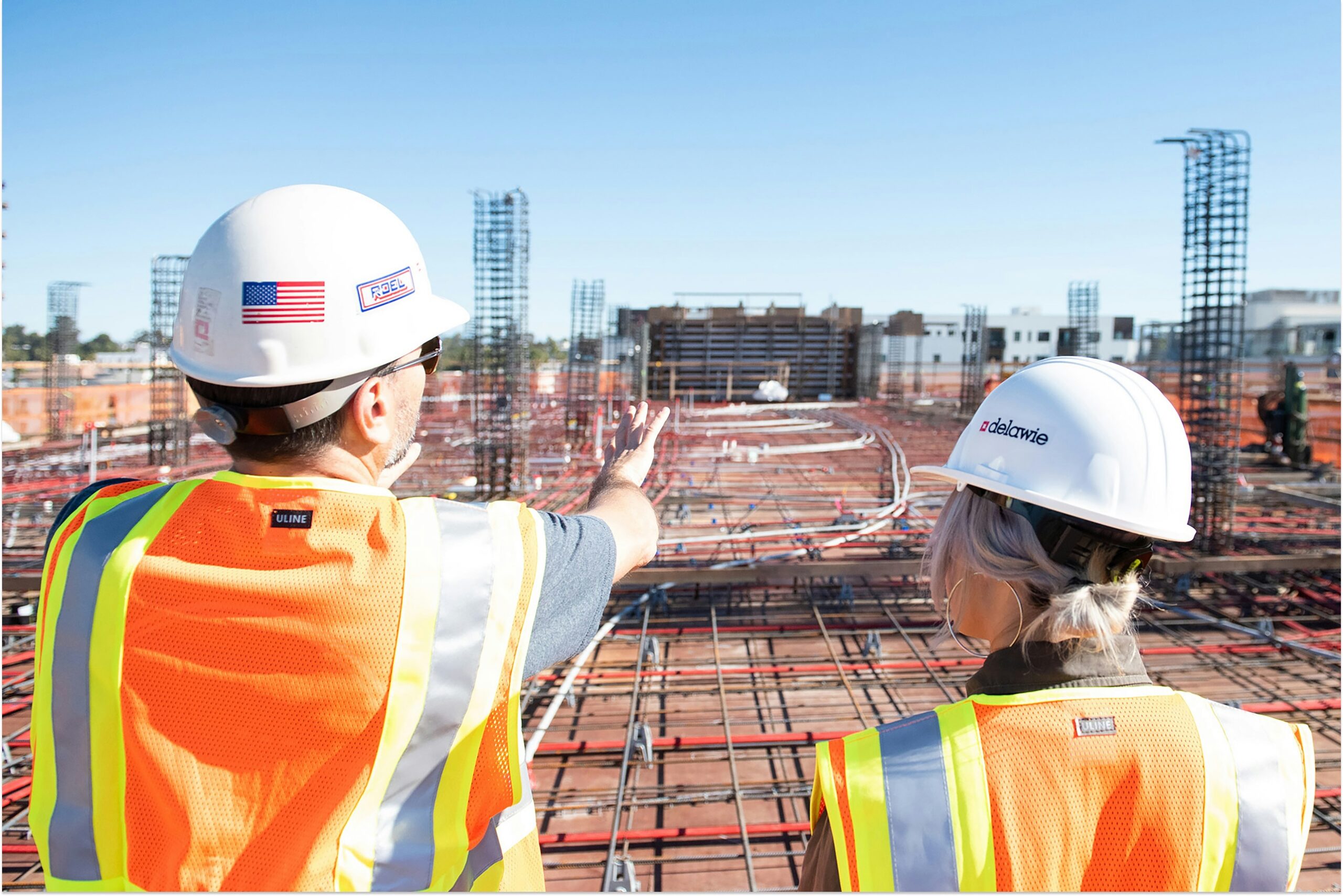commercial construction project management getting it right scaled Commercial Construction Project Management: Getting It Right 11 male and female construction worker planning at a construction site